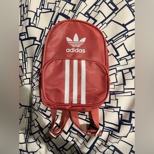 Adidas originals Santiago mini backpack in the color hazy rose pink